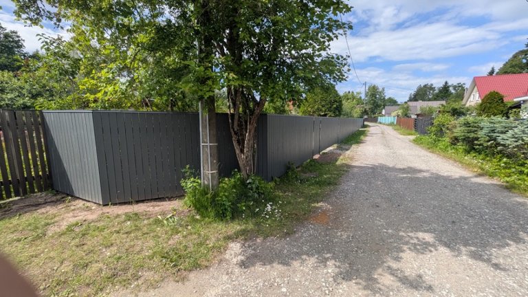 Anthracite vertical wooden fence with a corner
