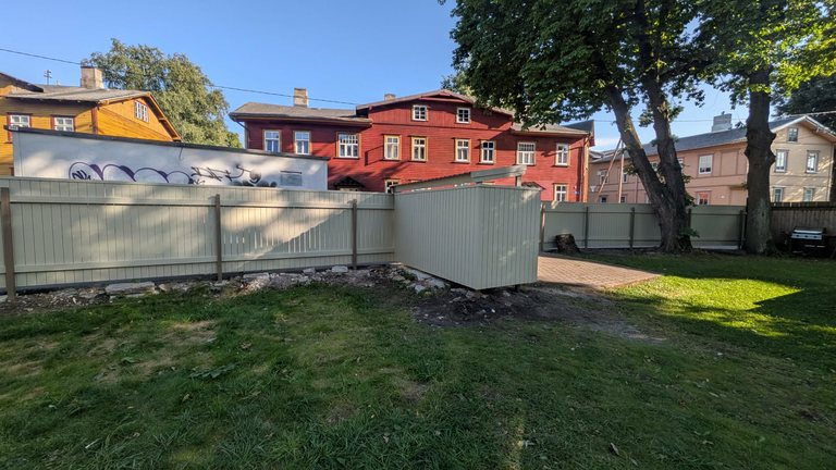 Matching wooden fence and bin store for an apartment association