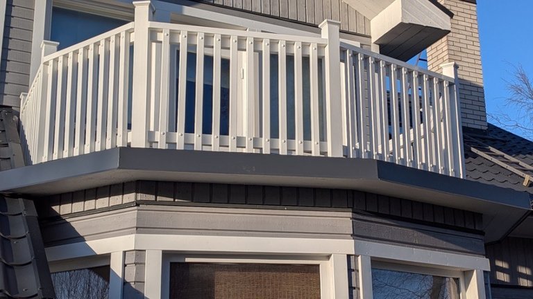 White timber balcony railing on a house