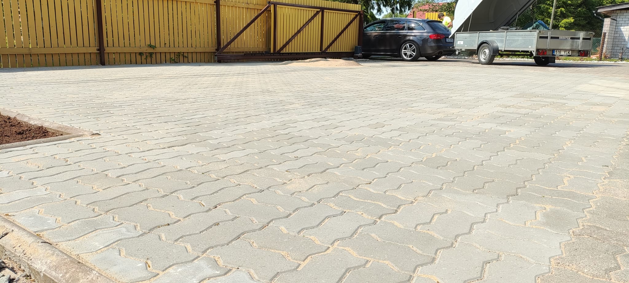 Laying and compacting the paved surface
