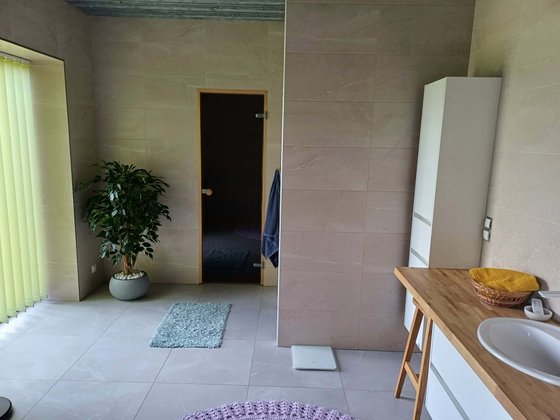 Tiled wet room with sauna glass door